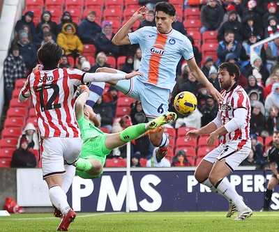 131225 - Stoke City v Swansea City - Sky Bet Championship - Goalkeeper Viktor Johansson of Stoke  makes a spectacular save from Marko Stamenic of Swansea in the 1st half with Tatsuki Seko of Stoke back up