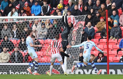 131225 - Stoke City v Swansea City - Sky Bet Championship - Goalkeeper Lawrence Vigouroux of Swansea makes a save from Robert Bozenik of Stoke in the 1st half