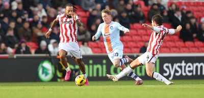 131225 - Stoke City v Swansea City - Sky Bet Championship - Ethan Galbraith of Swansea is tripped by Ben Pearson of Stoke 