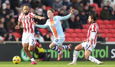 131225 - Stoke City v Swansea City - Sky Bet Championship - Ethan Galbraith of Swansea is tripped by Ben Pearson of Stoke 