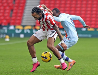131225 - Stoke City v Swansea City - Sky Bet Championship - Malick Yalcouye of Swansea and Sorba Thomas of Stoke