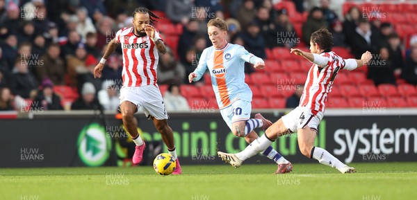 131225 - Stoke City v Swansea City - Sky Bet Championship - Ethan Galbraith of Swansea is tripped by Ben Pearson of Stoke 