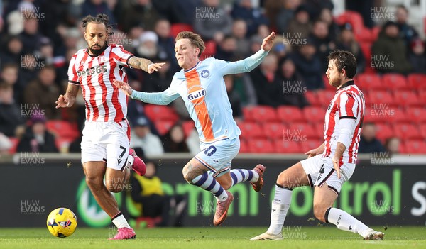 131225 - Stoke City v Swansea City - Sky Bet Championship - Ethan Galbraith of Swansea is tripped by Ben Pearson of Stoke 