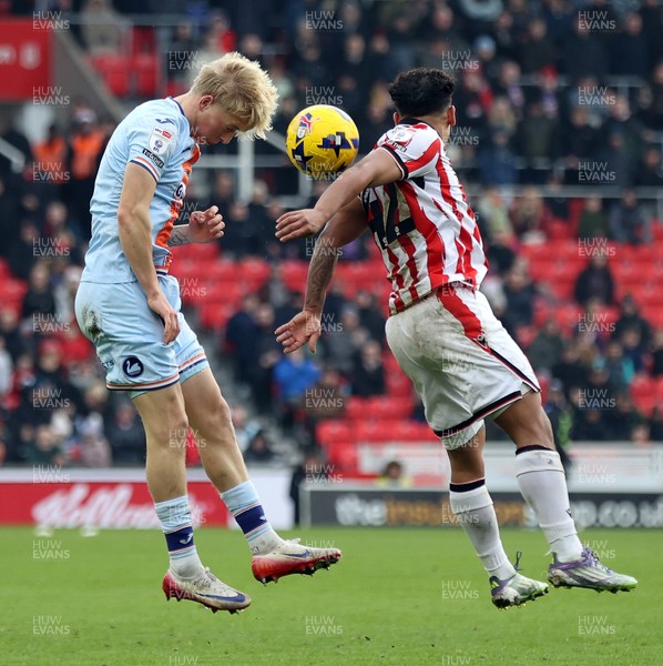 131225 - Stoke City v Swansea City - Sky Bet Championship - Melker Widell of Swansea and Million Manhoef of Stoke