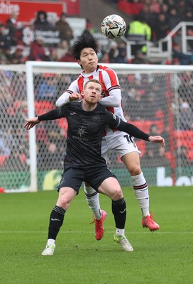 150225 - Stoke City v Swansea City - Sky Bet Championship - Lewis O'Brien of Swansea and Ba Jun-ho of Stoke City