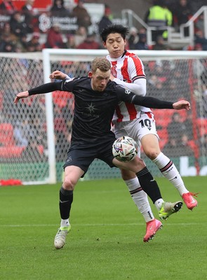 150225 - Stoke City v Swansea City - Sky Bet Championship - Lewis O'Brien of Swansea and Ba Jun-ho of Stoke City