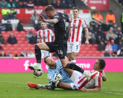 150225 - Stoke City v Swansea City - Sky Bet Championship - Goalkeeper Viktor Johansson of Stoke City fumbles the ball to put it in the path of Josh Tymon of Swansea who scores the 1st goal of the match