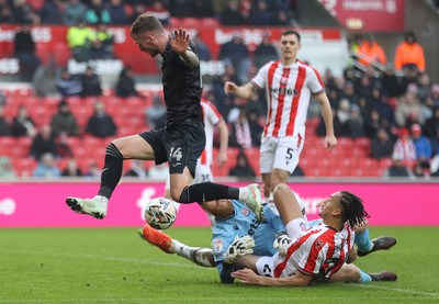 150225 - Stoke City v Swansea City - Sky Bet Championship - Goalkeeper Viktor Johansson of Stoke City fumbles the ball to put it in the path of Josh Tymon of Swansea who scores the 1st goal of the match