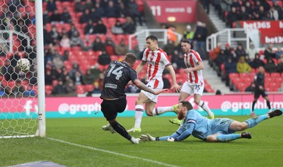 150225 - Stoke City v Swansea City - Sky Bet Championship - Goalkeeper Viktor Johansson of Stoke City fumbles the ball to put it in the path of Josh Tymon of Swansea who scores the 1st goal of the match