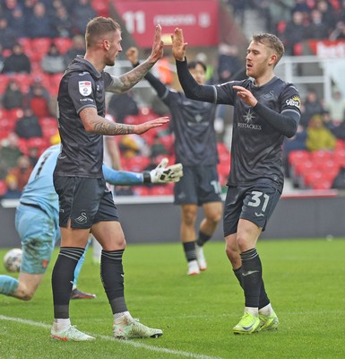 150225 - Stoke City v Swansea City - Sky Bet Championship - Josh Tymon of Swansea celebrates scoring the first goal of the match with Oli Cooper of Swansea