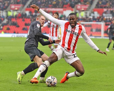 150225 - Stoke City v Swansea City - Sky Bet Championship - Oli Cooper of Swansea and Ben Gibson