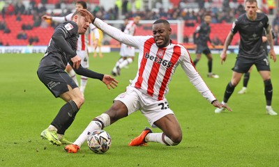 150225 - Stoke City v Swansea City - Sky Bet Championship - Oli Cooper of Swansea and Ben Gibson