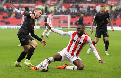 150225 - Stoke City v Swansea City - Sky Bet Championship - Oli Cooper of Swansea and Ben Gibson