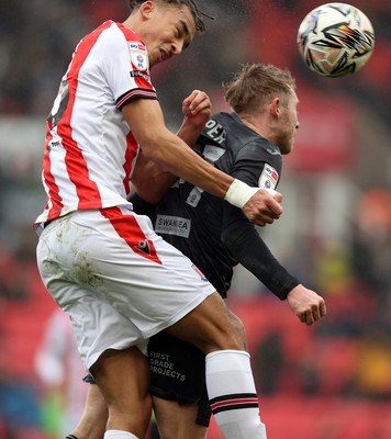 150225 - Stoke City v Swansea City - Sky Bet Championship - Oli Cooper of Swansea and Ashley Phillips of Stoke City