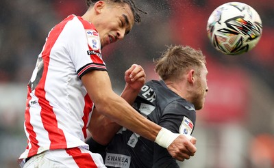 150225 - Stoke City v Swansea City - Sky Bet Championship - Oli Cooper of Swansea and Ashley Phillips of Stoke City