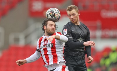 150225 - Stoke City v Swansea City - Sky Bet Championship - Lewis O'Brien of Swansea and Ben Pearson of Stoke City