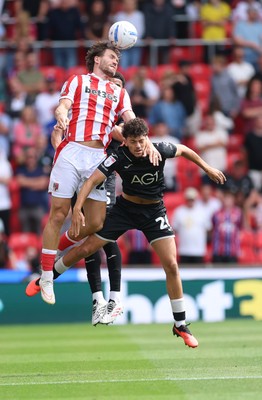 150826 - Stoke City v Swansea City, EFL Sky Bet Championship - Sam Gallagher of Stoke City and Filip Lissah of Swansea City compete for the ball