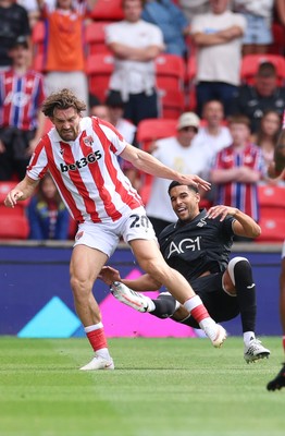 150826 - Stoke City v Swansea City, EFL Sky Bet Championship - Ben Cabango of Swansea City is brought down by Sam Gallagher of Stoke City