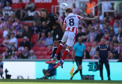150826 - Stoke City v Swansea City, EFL Sky Bet Championship - Marko Stamenic of Swansea City and Ethan Galbraith of Stoke City compete for the ball