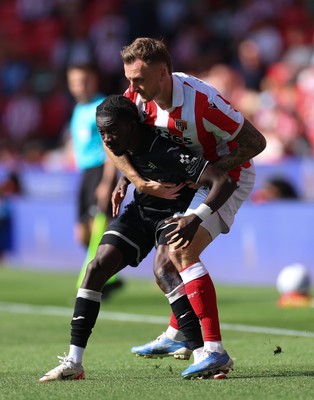 150826 - Stoke City v Swansea City, EFL Sky Bet Championship - Moussa Yeo of Swansea City is challenged by Ben Wilmot of Stoke City