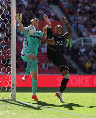 150826 - Stoke City v Swansea City, EFL Sky Bet Championship - Adam Idah of Swansea City challenges Stoke City goalkeeper Viktor Johansson for the ball