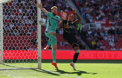 150826 - Stoke City v Swansea City, EFL Sky Bet Championship - Adam Idah of Swansea City challenges Stoke City goalkeeper Viktor Johansson for the ball