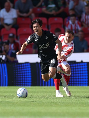 150826 - Stoke City v Swansea City, EFL Sky Bet Championship - Ji-Sung Eom of Swansea City is brought down by Robert Bozenik of Stoke City