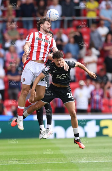 150826 - Stoke City v Swansea City, EFL Sky Bet Championship - Sam Gallagher of Stoke City and Filip Lissah of Swansea City compete for the ball