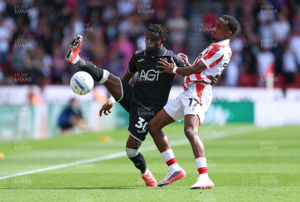 150826 - Stoke City v Swansea City, EFL Sky Bet Championship - Joseph Opoku of Swansea City and Eric Bocat of Stoke City compete for the ball
