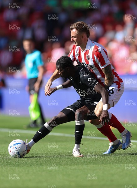 150826 - Stoke City v Swansea City, EFL Sky Bet Championship - Moussa Yeo of Swansea City is challenged by Ben Wilmot of Stoke City