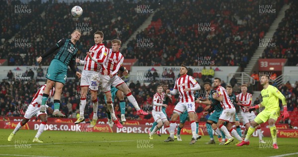 250120 - Stoke City v Swansea City - Sky Bet Championship - Marc Guehi of Swansea tries to head in from a corner   