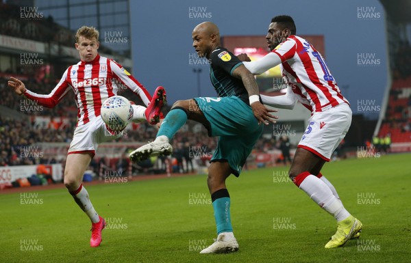 250120 - Stoke City v Swansea City - Sky Bet Championship - Andre Ayew of Swansea and James McClean of Stoke City and Bruno Martins Indi of Stoke City   