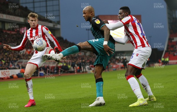 250120 - Stoke City v Swansea City - Sky Bet Championship - Andre Ayew of Swansea and James McClean of Stoke City and Bruno Martins Indi of Stoke City   