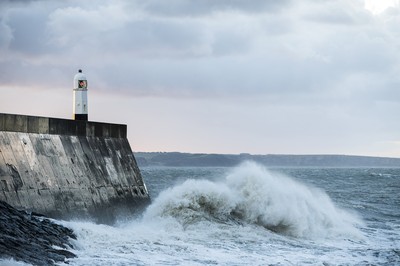 210918 - Picture shows the waves crash on the lighthouse in Porthcawl, South Wales, as Storm Branagh starts to hit the UK