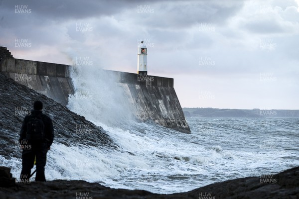 210918 - Picture shows the waves crash on the lighthouse in Porthcawl, South Wales, as Storm Branagh starts to hit the UK