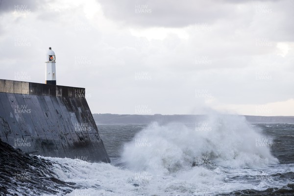 210918 - Picture shows the waves crash on the lighthouse in Porthcawl, South Wales, as Storm Branagh starts to hit the UK