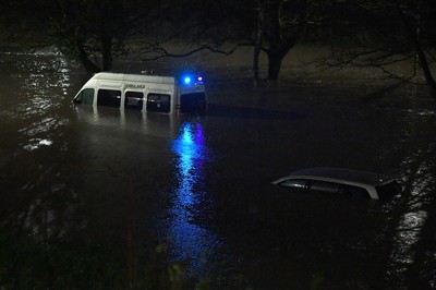 160220 - South Wales Flooding during Storm Dennis - A ambulance is surrounded by flood water in Nantgarw, South Wales