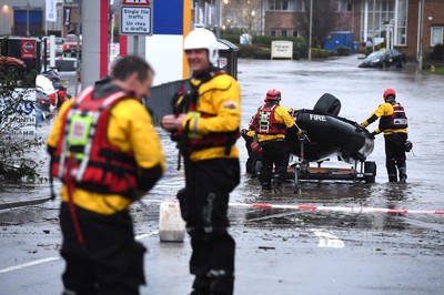 160220 - South Wales Flooding during Storm Dennis - Rescuers search flood water in Upper Boat, South Wales