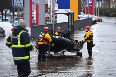 160220 - South Wales Flooding during Storm Dennis - Rescuers search flood water in Upper Boat, South Wales