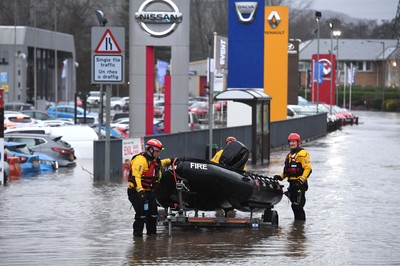 160220 - South Wales Flooding during Storm Dennis - Rescuers search flood water in Upper Boat, South Wales