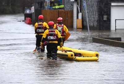 160220 - South Wales Flooding during Storm Dennis - Rescuers search flood water in Upper Boat, South Wales