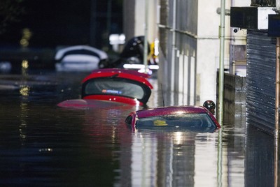 160220 - Picture shows the River Taff at Pontypridd, South Wales, Near Cardiff which has flooded peoples homes as Storm Dennis hits the region