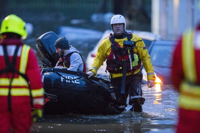 160220 - Picture shows people being rescued from Egypt Street, Pontypridd, Near Cardiff which has flooded in nearby streets and homes