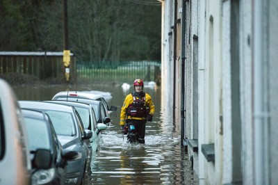 160220 - Picture shows people being rescued from Egypt Street, Pontypridd, Near Cardiff which has flooded in nearby streets and homes