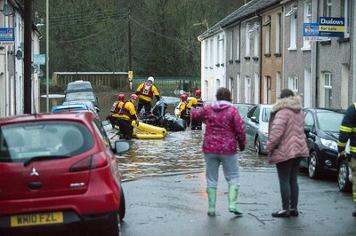 160220 - Picture shows people being rescued from Egypt Street, Pontypridd, Near Cardiff which has flooded in nearby streets and homes