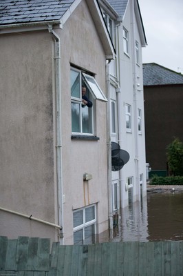 160220 - Flooding hits homes in Taffs Well north of Cardiff in south Wales as the River Taff bursts it's banks from the effects of storm Dennis