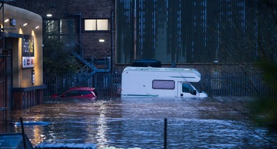 160220 -  Vehicles are submerged at the Royal Mail sorting office and other industrial units at Taffs Well north of Cardiff in south Wales are flooded as the River Taff bursts it's banks from the effects of storm Dennis