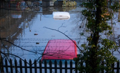 160220 -  Vehicles are submerged at the Royal Mail sorting office and other industrial units at Taffs Well north of Cardiff in south Wales are flooded as the River Taff bursts it's banks from the effects of storm Dennis