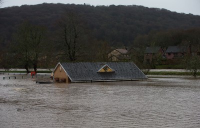 160220 -  The nursery and bowls club alongside the River Taff at Taffs Well north of Cardiff in south Wales are submerged as the the river bursts it's banks from the effects of storm Dennis