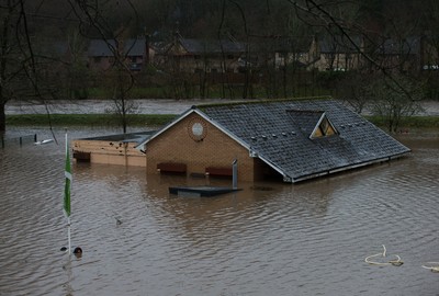 160220 -  The nursery and bowls club alongside the River Taff at Taffs Well north of Cardiff in south Wales are submerged as the the river bursts it's banks from the effects of storm Dennis